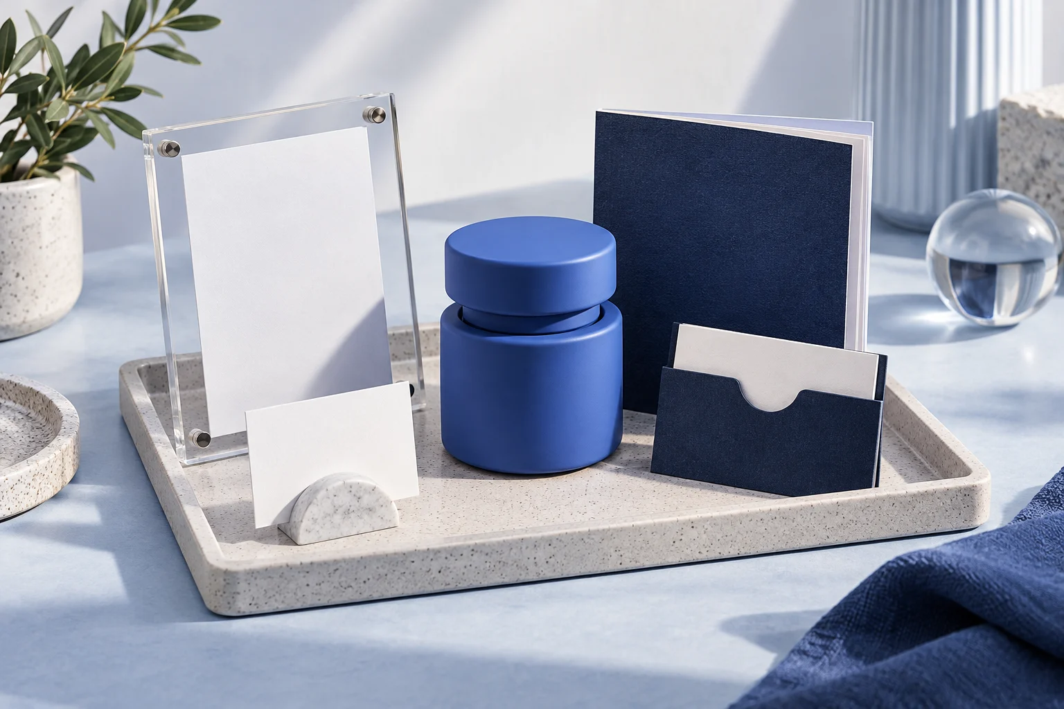 A small coordinated product launch kit containing a feature frame, availability card, tutorial booklet and support card arranged around a single released product.